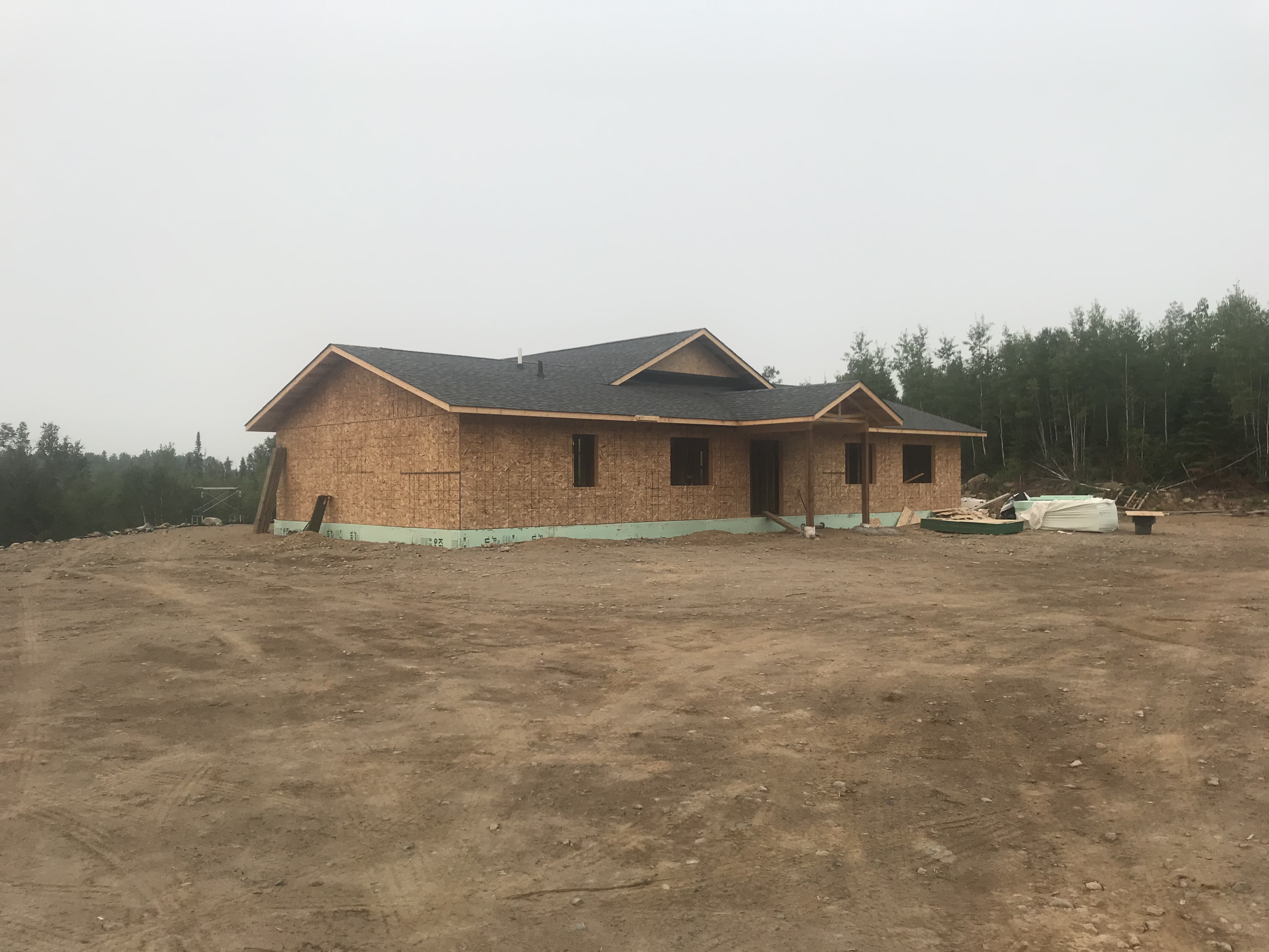 Finished concrete path leading to a Thunder Bay home