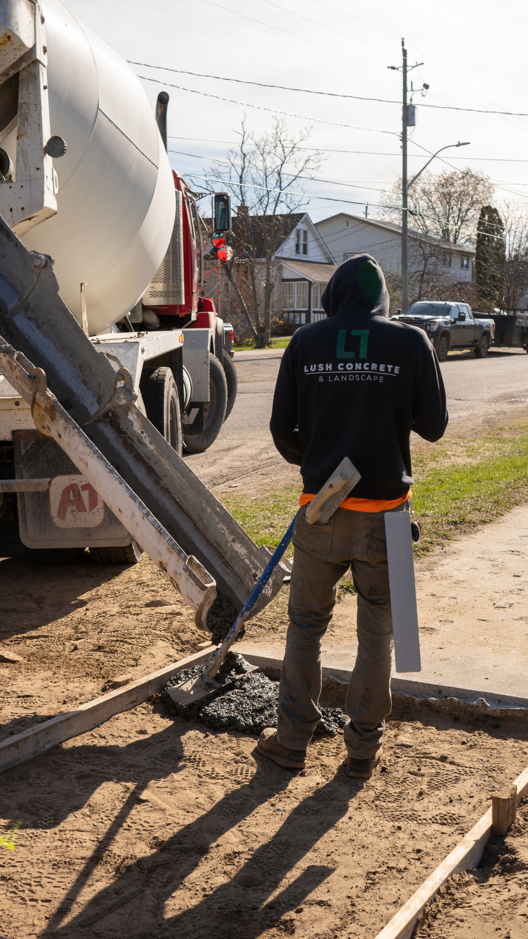 Concrete mixer chute placing concrete on a Lush job in Thunder Bay