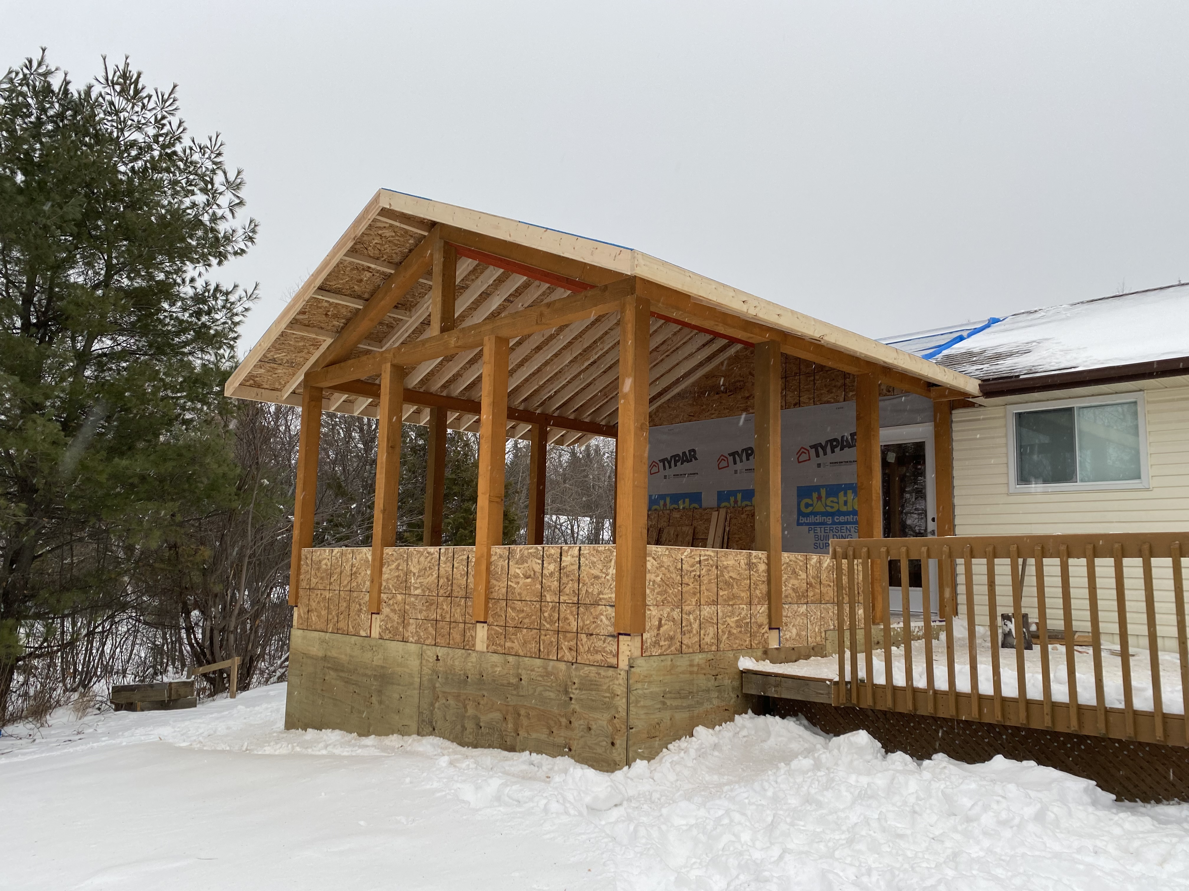 Two-storey OSB shell on an insulated ICF foundation, mid-summer