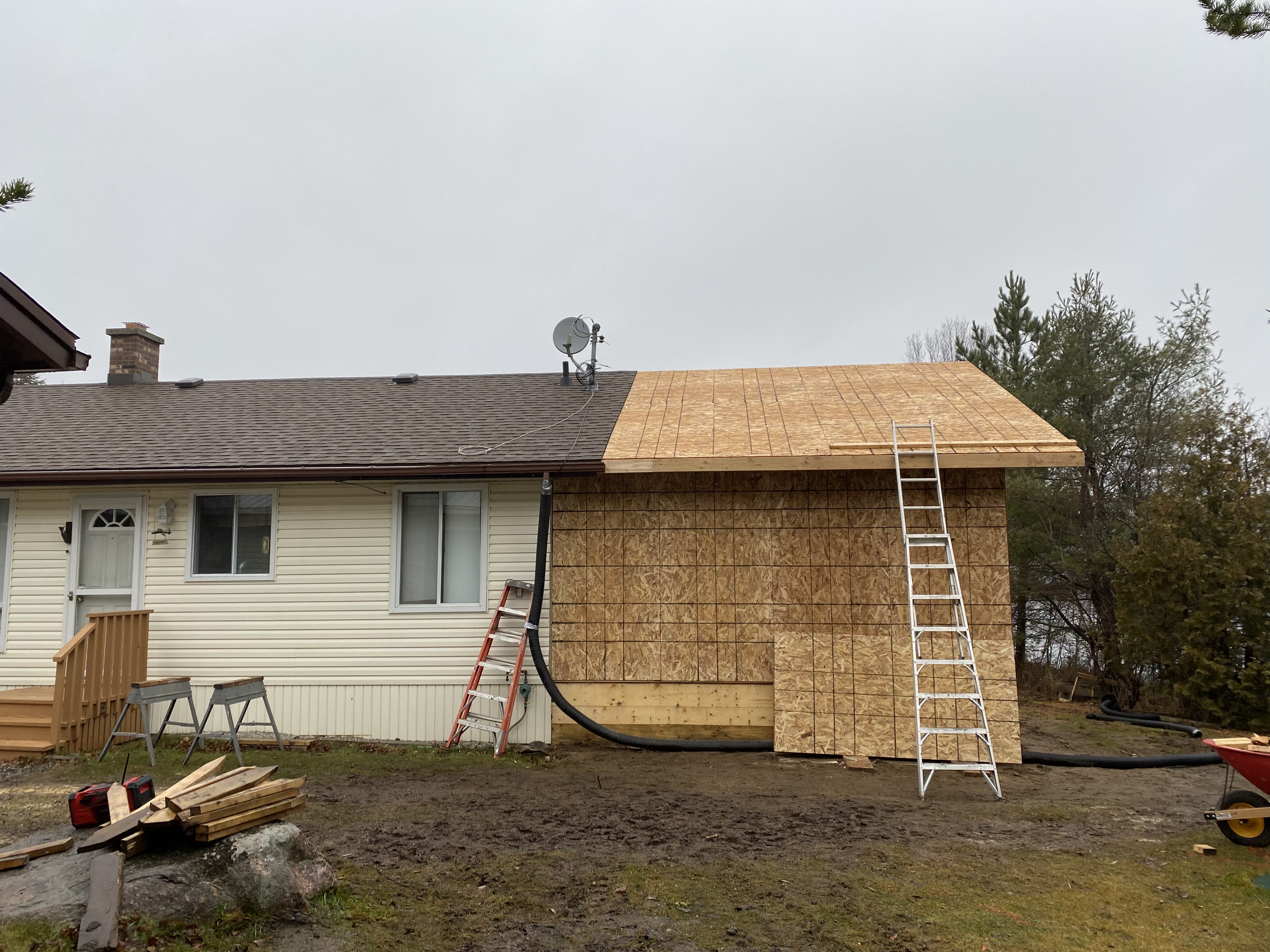 Covered porch build with timber posts going up in winter