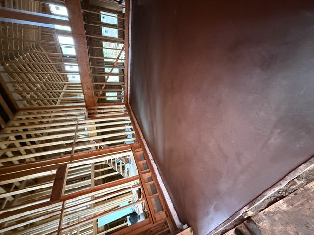 Fresh interior concrete floor placed and floated inside a new build