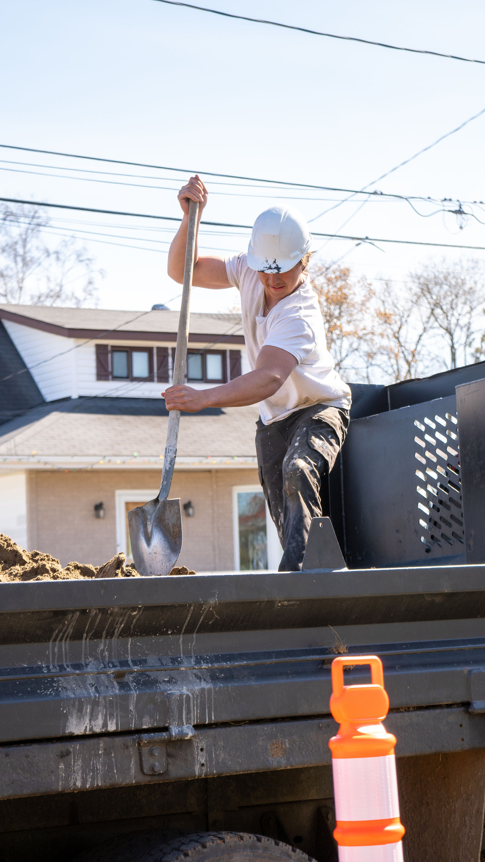 Shoveling dirt out of the pit