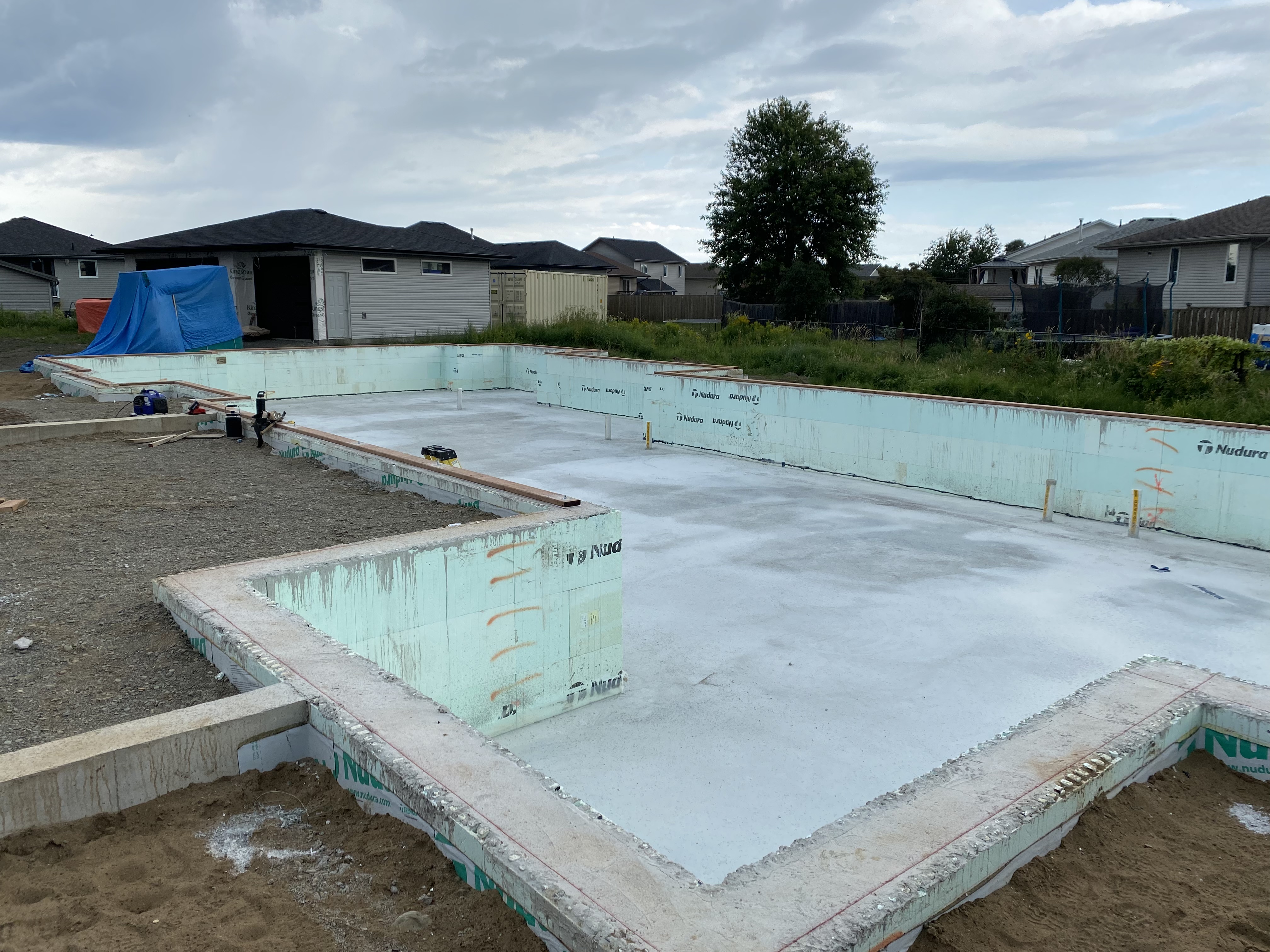 Smooth trowel-finished concrete floor inside a Thunder Bay build