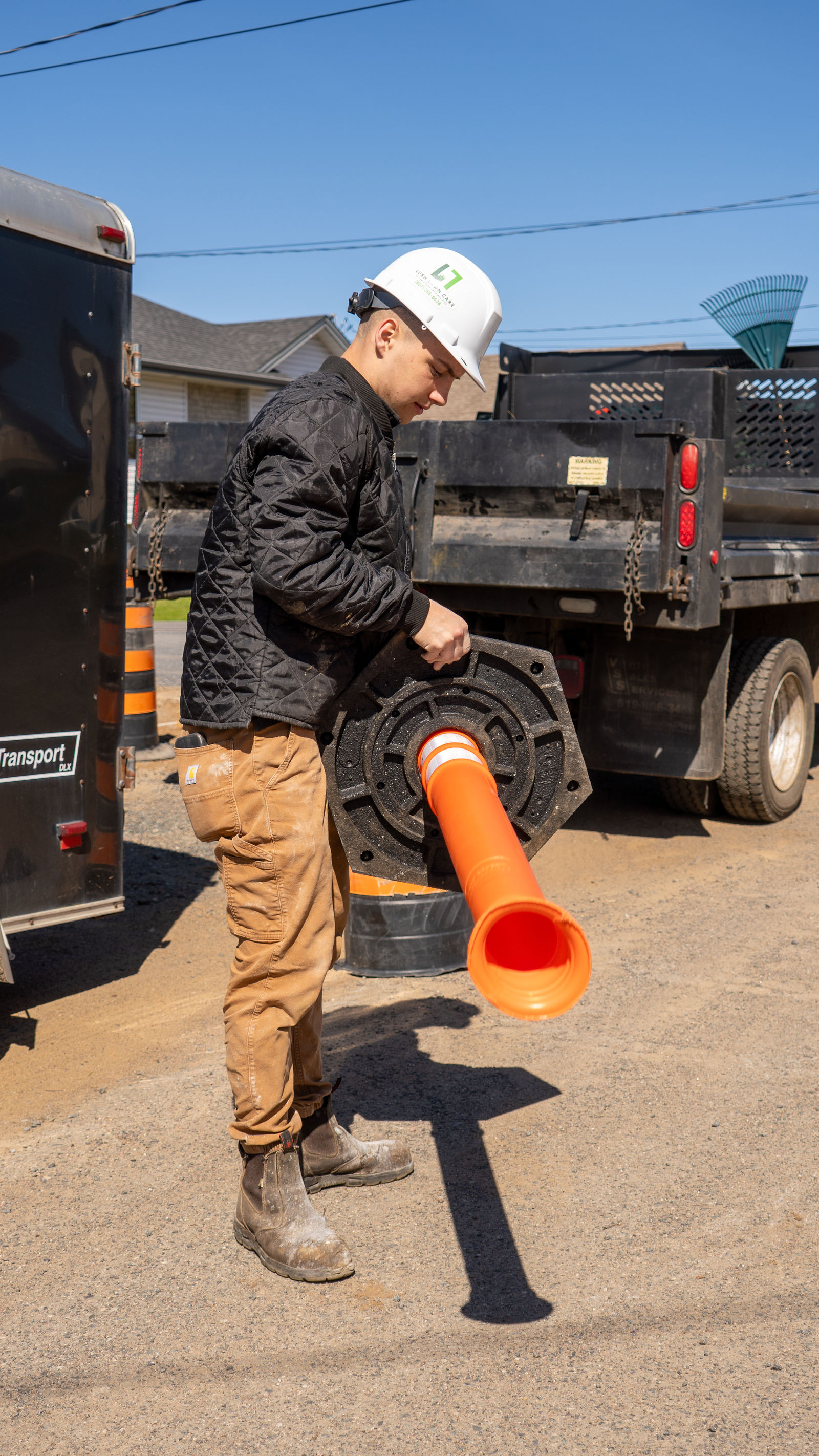 Foreman staging traffic-control pipes